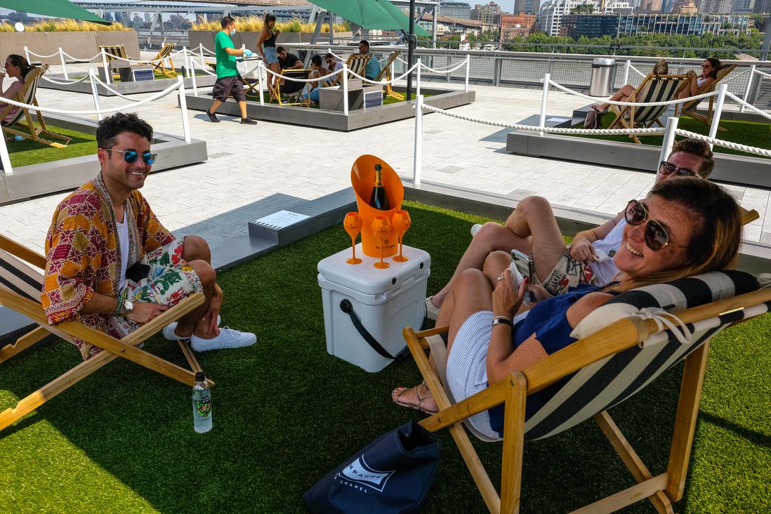 Small artificial grass squares on the rooftop of Pier 17's mall